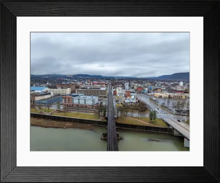 Framed Print : Elmira, NY, USA - 03-02-2024 - Cloudy winter aerial image of the downtown area in the City of Elmira Framed Print : Elmira, NY, USA - 03-02-2024 - Cloudy winter aerial image of the downtown area in the City of Elmira