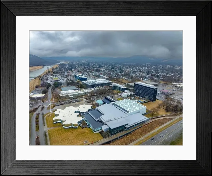 Framed Print : Corning, NY, USA - 03-02-2024 - Cloudy winter aerial image of the downtown area in the City of Corning