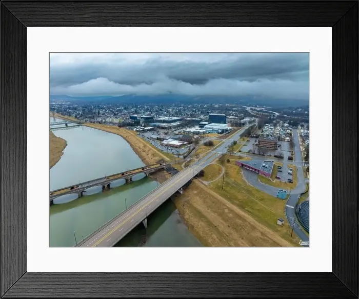Framed Print : Corning, NY, USA - 03-02-2024 - Cloudy winter aerial image of the downtown area in the City of Corning Framed Print : Corning, NY, USA - 03-02-2024 - Cloudy winter aerial image of the downtown area in the City of Corning