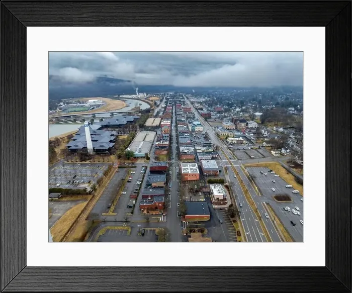 Framed Print : Corning, NY, USA - 03-02-2024 - Cloudy winter aerial image of the downtown area in the City of Corning Framed Print : Corning, NY, USA - 03-02-2024 - Cloudy winter aerial image of the downtown area in the City of Corning