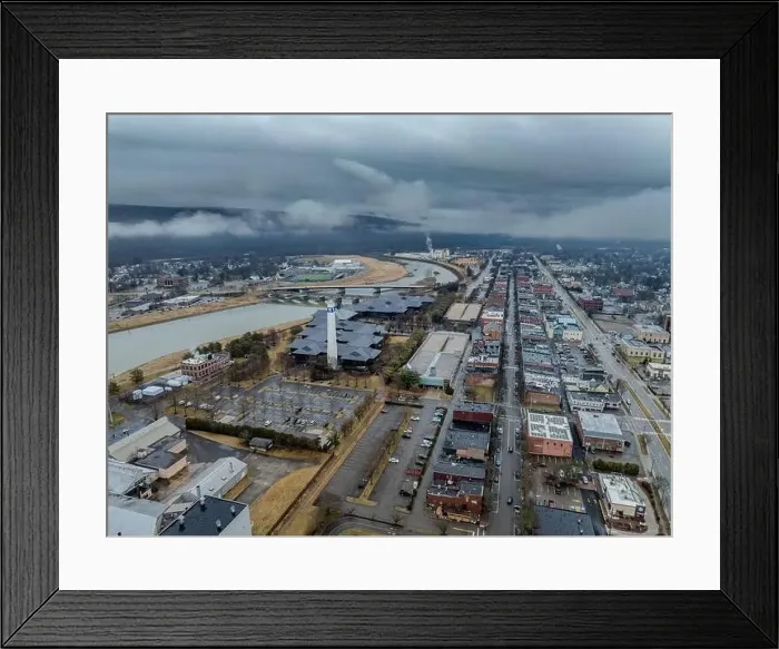 Framed Print : Corning, NY, USA - 03-02-2024 - Cloudy winter aerial image of the downtown area in the City of Corning Framed Print : Corning, NY, USA - 03-02-2024 - Cloudy winter aerial image of the downtown area in the City of Corning