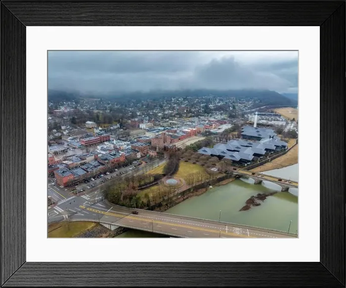 Framed Print : Corning, NY, USA - 03-02-2024 - Cloudy winter aerial image of the downtown area in the City of Corning
