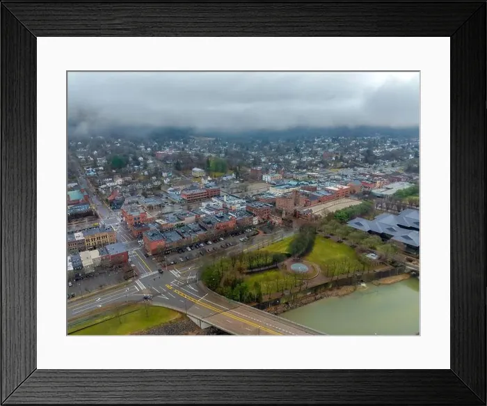 Framed Print : Corning, NY, USA - 03-02-2024 - Cloudy winter aerial image of the downtown area in the City of Corning Framed Print : Corning, NY, USA - 03-02-2024 - Cloudy winter aerial image of the downtown area in the City of Corning