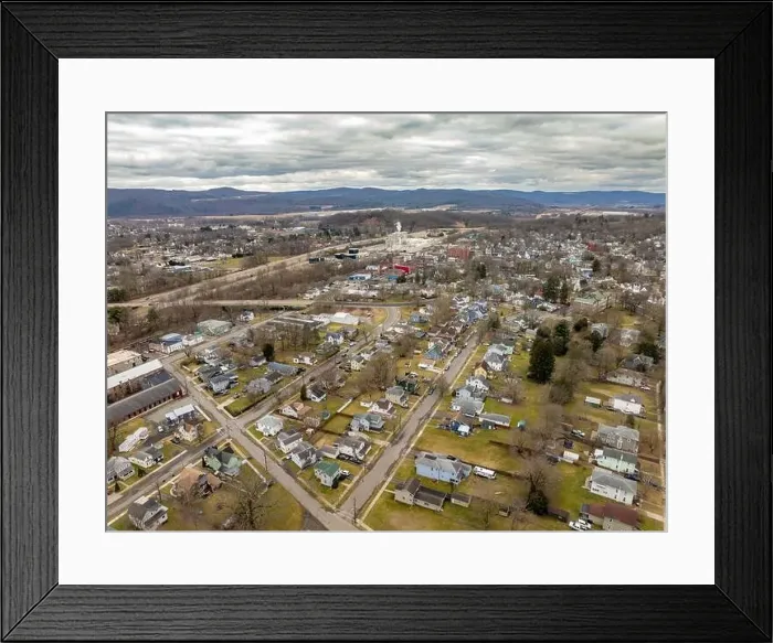 Framed Print : Waverly, NY, USA - 03-03-2024 - Cloudy winter aerial image of the downtown area in the Village of Waverly, NY
