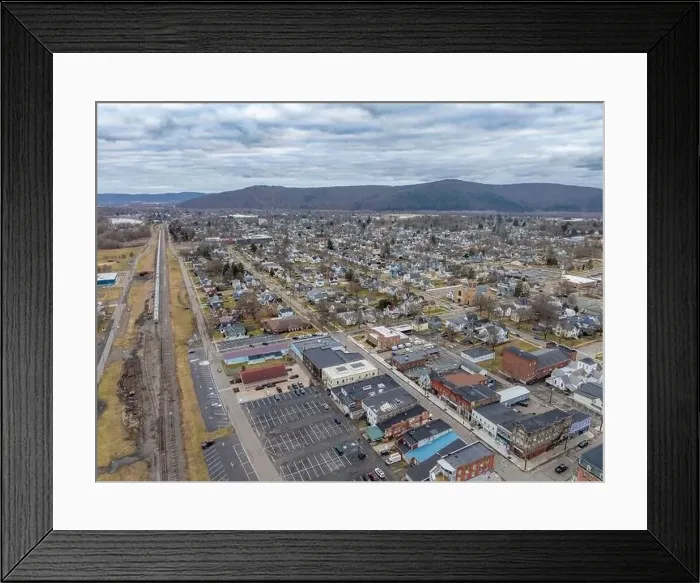 Framed Print : Sayre, PA, USA - 03-03-2024 - Cloudy winter aerial image of the downtown area in the City of Sayre, PA Framed Print : Sayre, PA, USA - 03-03-2024 - Cloudy winter aerial image of the downtown area in the City of Sayre, PA