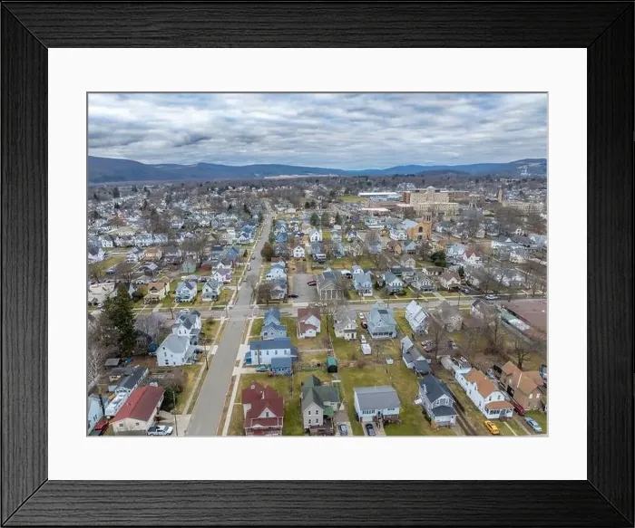 Framed Print : Sayre, PA, USA - 03-03-2024 - Cloudy winter aerial image of the downtown area in the City of Sayre, PA Framed Print : Sayre, PA, USA - 03-03-2024 - Cloudy winter aerial image of the downtown area in the City of Sayre, PA