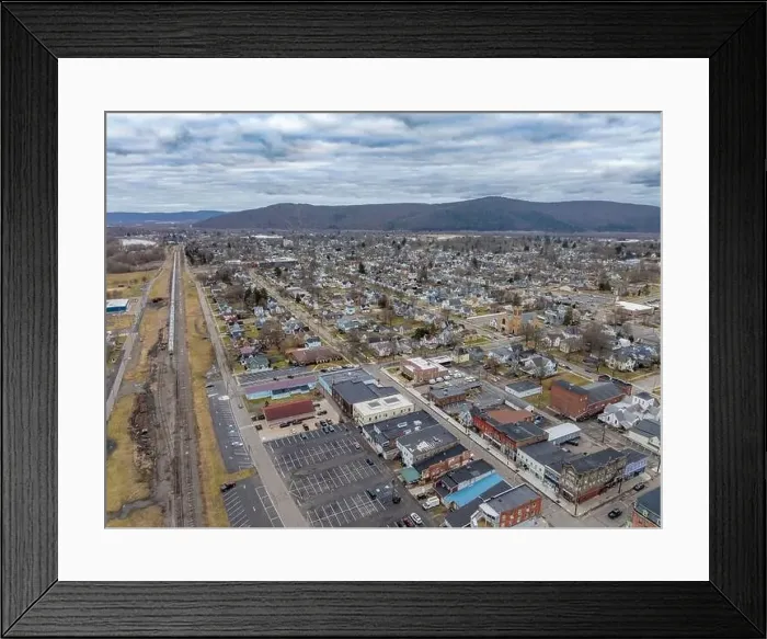Framed Print : Sayre, PA, USA - 03-03-2024 - Cloudy winter aerial image of the downtown area in the City of Sayre, PA Framed Print : Sayre, PA, USA - 03-03-2024 - Cloudy winter aerial image of the downtown area in the City of Sayre, PA