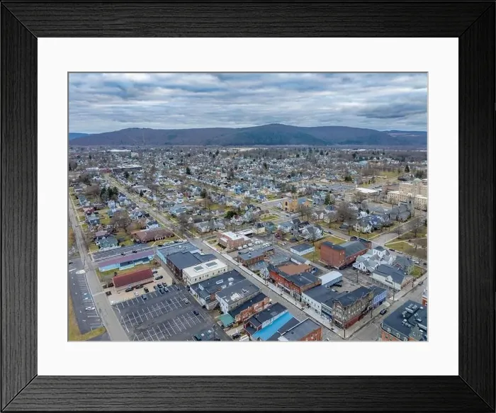 Framed Print : Sayre, PA, USA - 03-03-2024 - Cloudy winter aerial image of the downtown area in the City of Sayre, PA Framed Print : Sayre, PA, USA - 03-03-2024 - Cloudy winter aerial image of the downtown area in the City of Sayre, PA