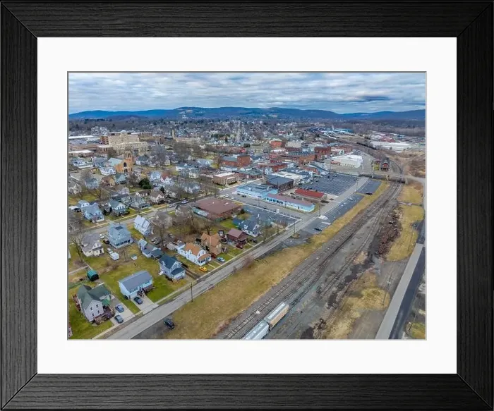 Framed Print : Sayre, PA, USA - 03-03-2024 - Cloudy winter aerial image of the downtown area in the City of Sayre, PA Framed Print : Sayre, PA, USA - 03-03-2024 - Cloudy winter aerial image of the downtown area in the City of Sayre, PA