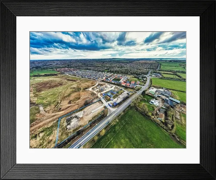 Framed Print : Aerial view of a suburban development with houses, roads, and construction area in Harrogate, North Yorkshire Framed Print : Aerial view of a suburban development with houses, roads, and construction area in Harrogate, North Yorkshire