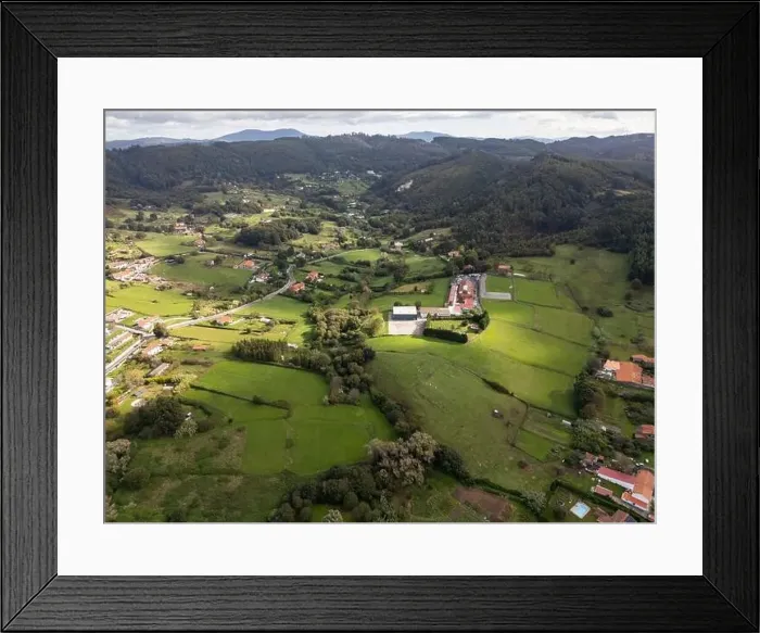 Framed Print : A drone captures the tranquil beauty of a green rural area with sports fields among rolling hills Framed Print : A drone captures the tranquil beauty of a green rural area with sports fields among rolling hills