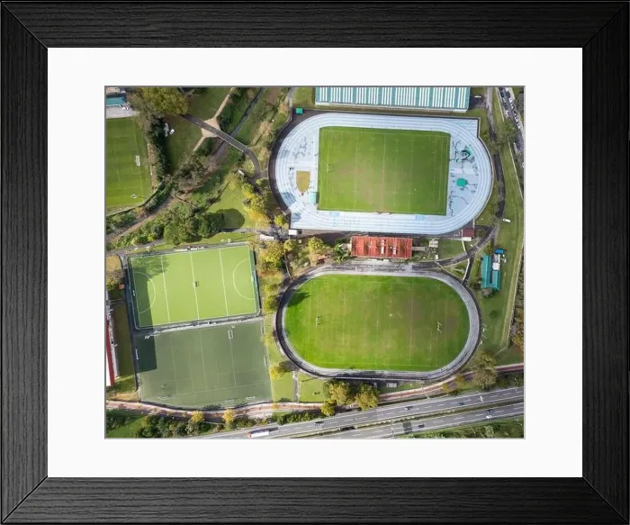 Framed Print : A top-down drone photograph showcasing various sports fields including a running track Framed Print : A top-down drone photograph showcasing various sports fields including a running track