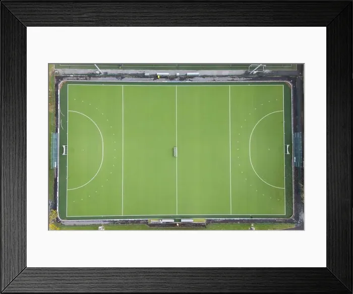 Framed Print : Aerial view of empty green soccer fields with white markings, captured by a drone Framed Print : Aerial view of empty green soccer fields with white markings, captured by a drone