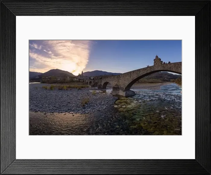 Framed Print : Aerial view of Bobbio town and Gobbo Bridge of Devil at sunset. Trebbia Valley, Emilia Romagna, Piacenza, Italy Framed Print : Aerial view of Bobbio town and Gobbo Bridge of Devil at sunset. Trebbia Valley, Emilia Romagna, Piacenza, Italy