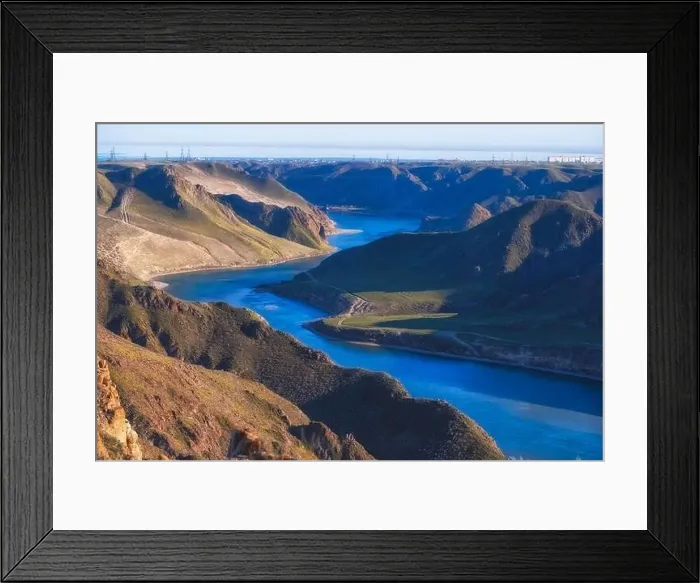 Framed Print : Beautiful large river Ili in Kazakhstan with blue transparent water, top view in the spring