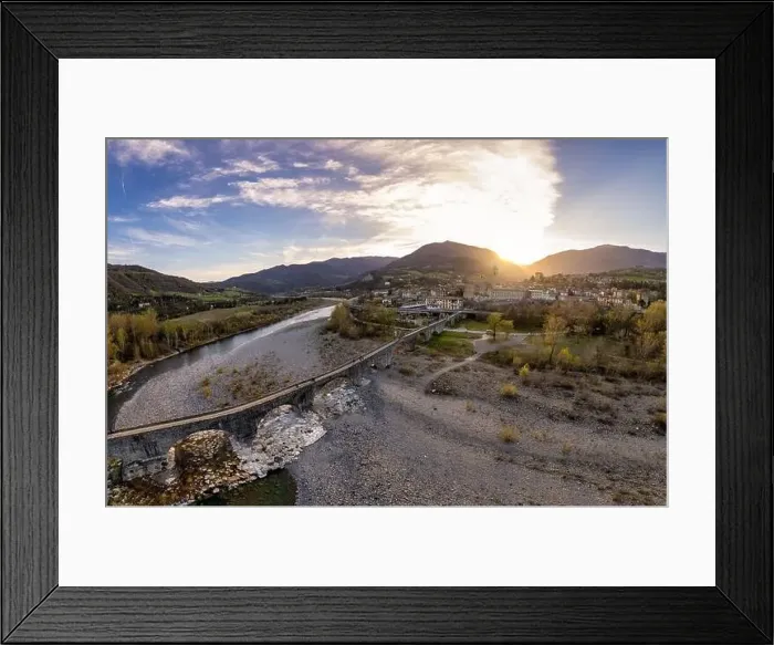 Framed Print : Aerial view of Bobbio town and Gobbo Bridge of Devil at sunset. Trebbia Valley, Emilia Romagna, Piacenza, Italy Framed Print : Aerial view of Bobbio town and Gobbo Bridge of Devil at sunset. Trebbia Valley, Emilia Romagna, Piacenza, Italy