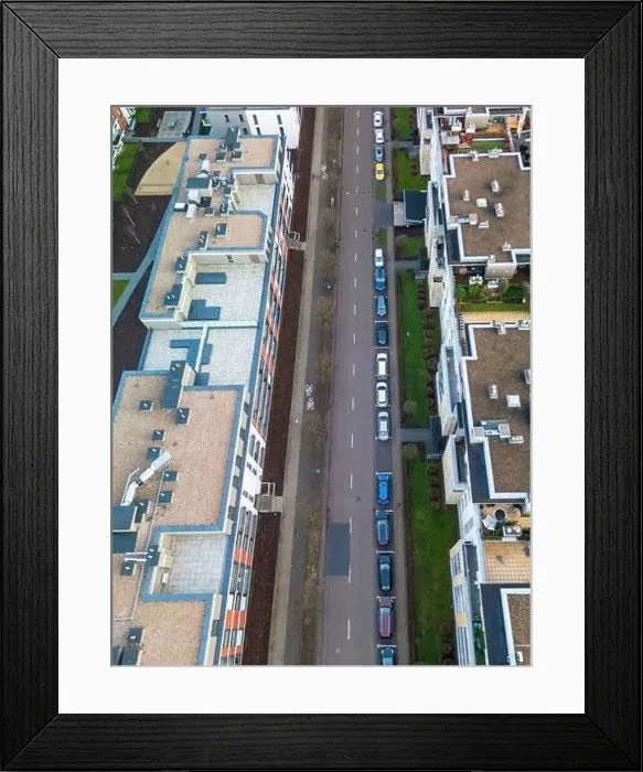 Framed Print : A top aerial, vertical view of a modern street in an apartment complex with bicycle paths and street Framed Print : A top aerial, vertical view of a modern street in an apartment complex with bicycle paths and street
