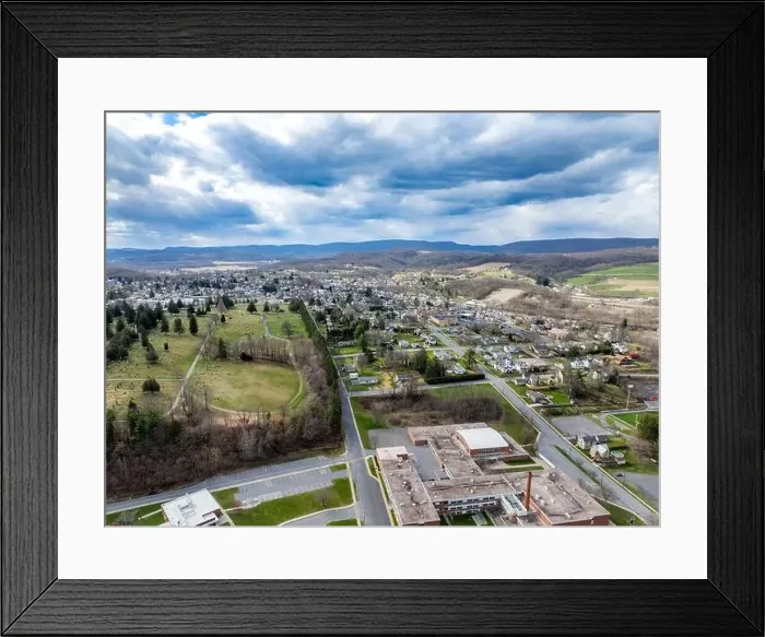 Framed Print : Jersey Shore, PA, USA - 03-17-2024 - Cloudy winter / spring aerial image of the borough Framed Print : Jersey Shore, PA, USA - 03-17-2024 - Cloudy winter / spring aerial image of the borough