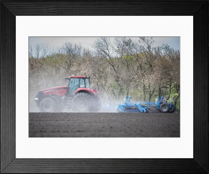 Framed Print : Earth's Canvas: Tractor Cultivating the Landscape Framed Print : Earth's Canvas: Tractor Cultivating the Landscape
