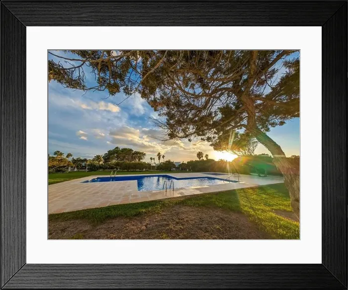 Framed Print : Aerial drone view of the harbor, housing and the beach of Cala en Bosc on the Spanish island of Menorca Framed Print : Aerial drone view of the harbor, housing and the beach of Cala en Bosc on the Spanish island of Menorca