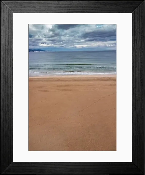 Framed Print : Aerial view to a beach, calm sea and cloudy sky Framed Print : Aerial view to a beach, calm sea and cloudy sky