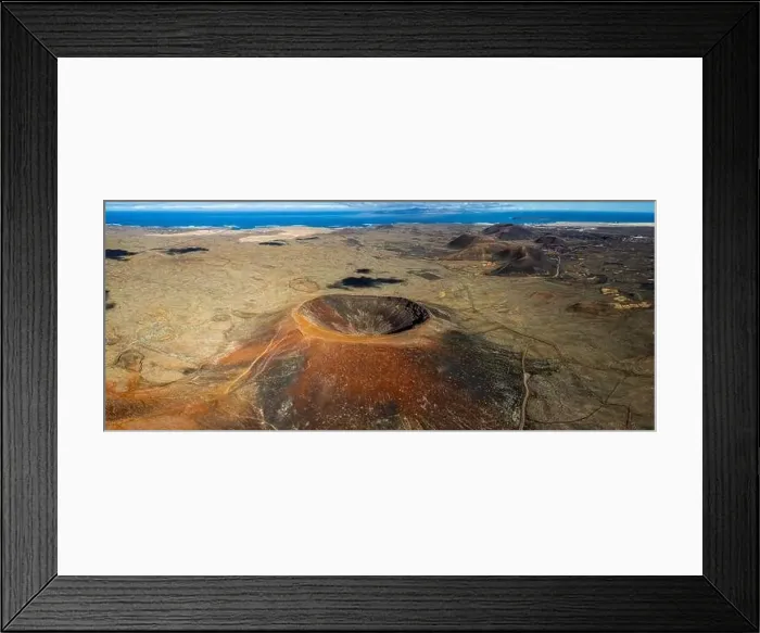 Framed Print : Aerial panorama capturing the vastness of a volcanic terrain with a prominent crater and textured ground Framed Print : Aerial panorama capturing the vastness of a volcanic terrain with a prominent crater and textured ground