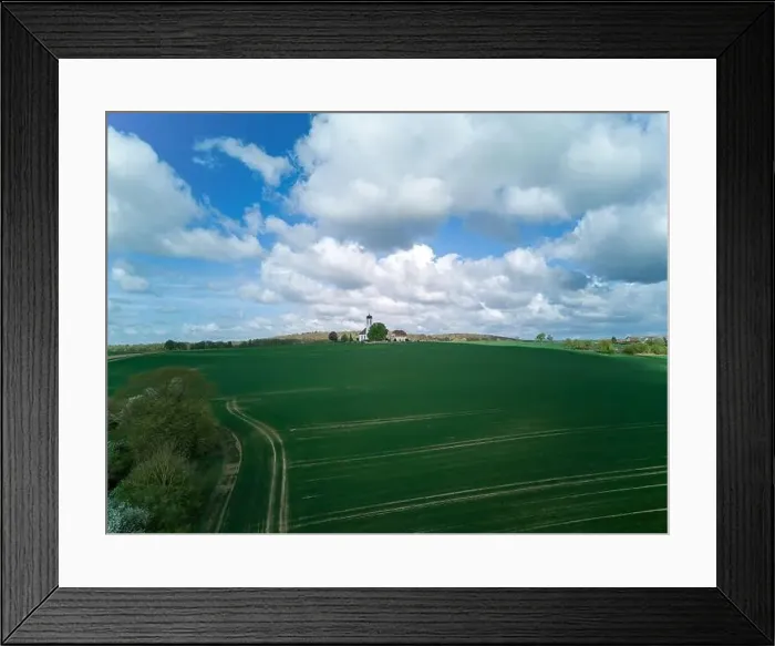 Framed Print : Small church with cemetery in the middle of blooming fruit trees and fields captured with a drone in spring Framed Print : Small church with cemetery in the middle of blooming fruit trees and fields captured with a drone in spring