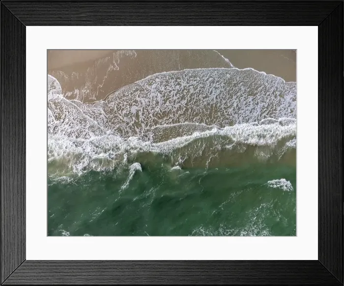 Framed Print : Ocean waves crashing onto a sandy beach, aerial view top-down Framed Print : Ocean waves crashing onto a sandy beach, aerial view top-down