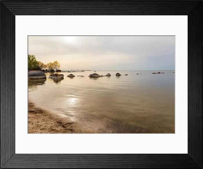 Framed Print : A natural landscape with a rocky beach by the water Framed Print : A natural landscape with a rocky beach by the water