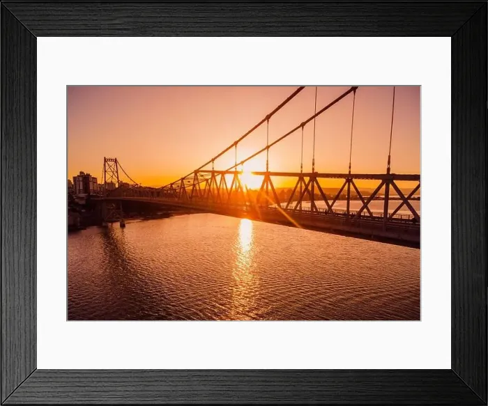 Framed Print : Hercilio luz cable bridge with sunset light in Florianopolis. Aerial view Framed Print : Hercilio luz cable bridge with sunset light in Florianopolis. Aerial view