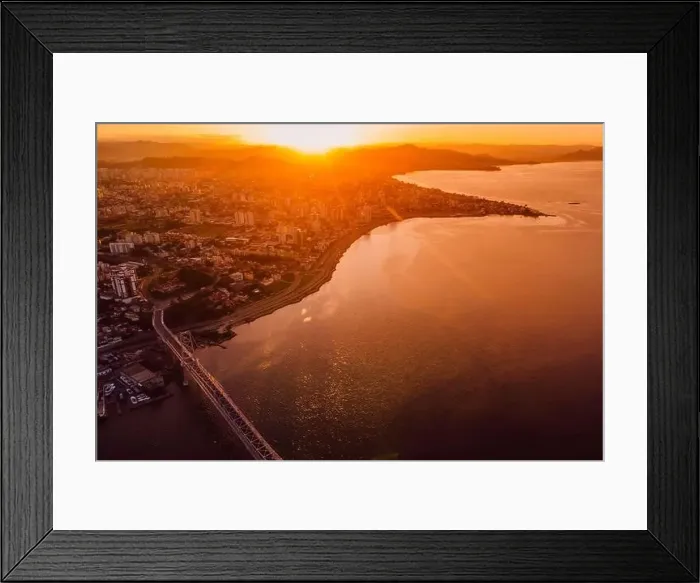 Framed Print : Cable bridge and downtown with sunset light in Florianopolis, Brazil. Drone view Framed Print : Cable bridge and downtown with sunset light in Florianopolis, Brazil. Drone view