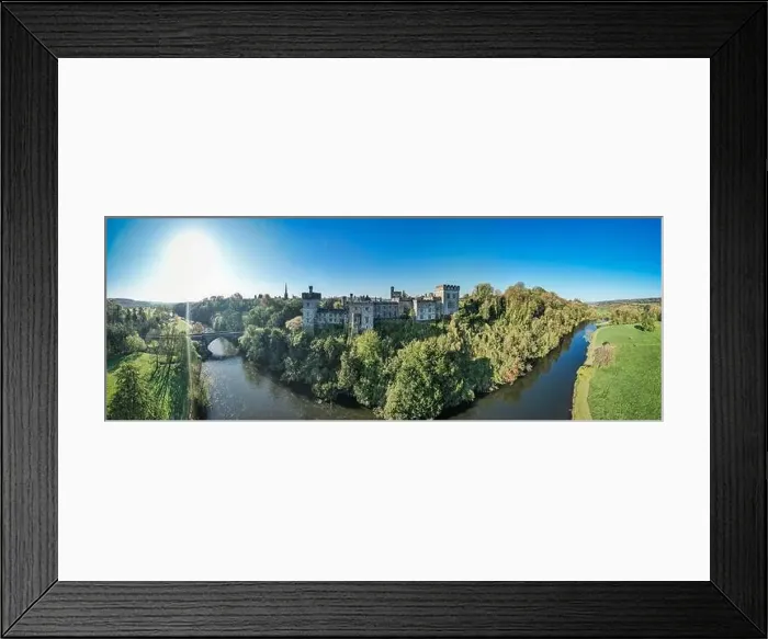 Framed Print : An aerial panorama reveals the majestic Lismore Castle in County Waterford, Ireland, set against a flawless spring sky Framed Print : An aerial panorama reveals the majestic Lismore Castle in County Waterford, Ireland, set against a flawless spring sky