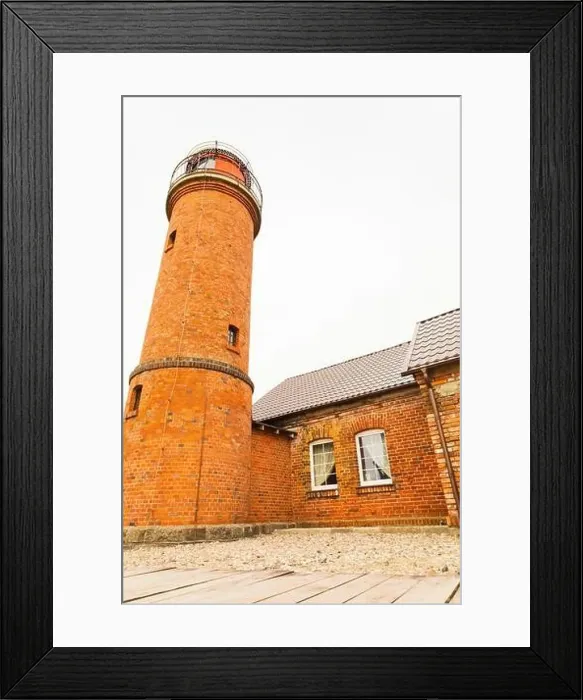 Framed Print : A charming brick cottage with a wooden lighthouse perched on its roof Framed Print : A charming brick cottage with a wooden lighthouse perched on its roof