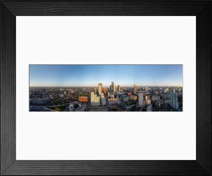 Framed Print : Manchester aerial cityscape showcases the towering skyscrapers near Deansgate square under the clear blue sky Framed Print : Manchester aerial cityscape showcases the towering skyscrapers near Deansgate square under the clear blue sky