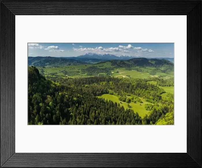 Framed Print : Aerial drone view over green hills of Pieniny National Park and snowy Tatra Mountains Framed Print : Aerial drone view over green hills of Pieniny National Park and snowy Tatra Mountains