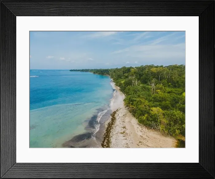 Framed Print : Aerial view of a serene beach with clear blue waters along Costa Rica's lush coastline Framed Print : Aerial view of a serene beach with clear blue waters along Costa Rica's lush coastline