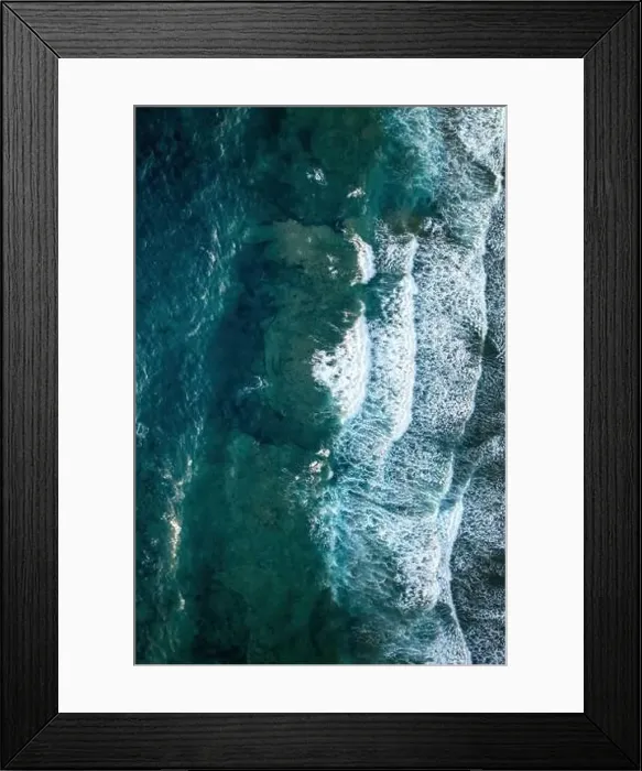 Framed Print : A stunning aerial photo capturing the clear turquoise waters and gentle waves along the Sardinian coast Framed Print : A stunning aerial photo capturing the clear turquoise waters and gentle waves along the Sardinian coast