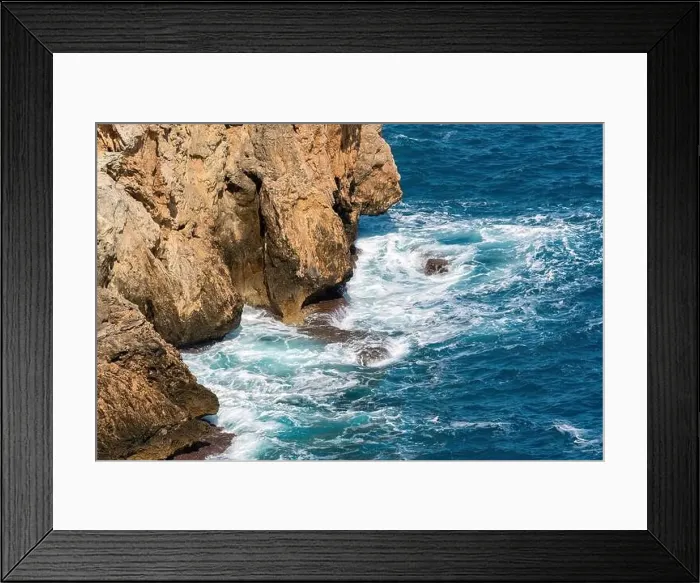Framed Print : Waves of a deep blue sea crashing against the rocks in Antalya Turkey Framed Print : Waves of a deep blue sea crashing against the rocks in Antalya Turkey