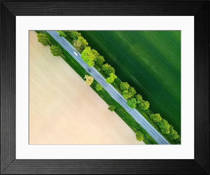 Framed Print : Aerial view of road through fields Framed Print : Aerial view of road through fields