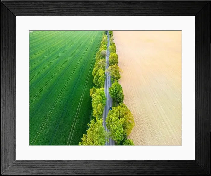Framed Print : Aerial view of road through fields Framed Print : Aerial view of road through fields