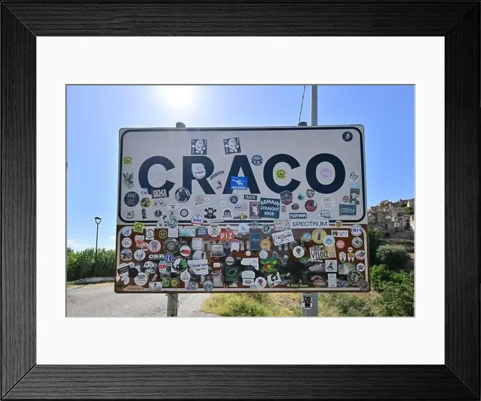 Framed Print : Craco, Italy - Aug 6, 2023: Sign at the entrance of the abandoned village of Craco, Basilicata region, Italy Framed Print : Craco, Italy - Aug 6, 2023: Sign at the entrance of the abandoned village of Craco, Basilicata region, Italy