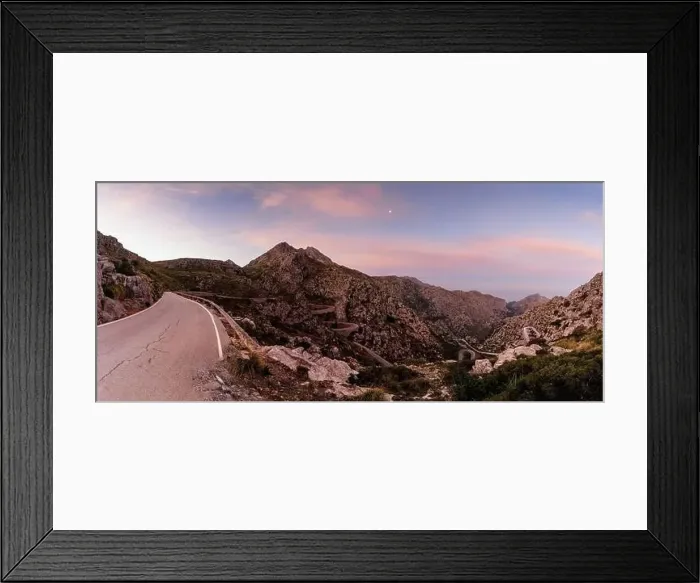 Framed Print : panorama sunrise landscape in the Tramuntana mountains of Mallorca with a view of the landmark snake road leading down Framed Print : panorama sunrise landscape in the Tramuntana mountains of Mallorca with a view of the landmark snake road leading down