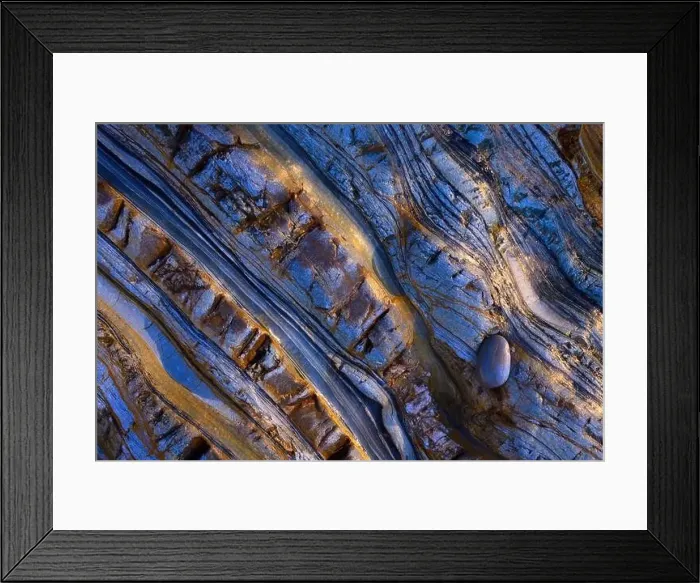 Framed Print : Abstract aerial view of textured rock formations with intricate laminations and a solitary pebble Framed Print : Abstract aerial view of textured rock formations with intricate laminations and a solitary pebble