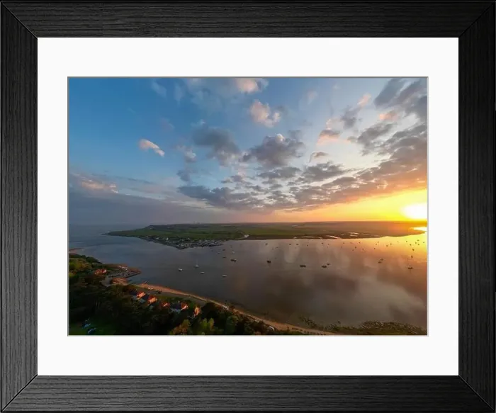 Framed Print : An aerial view of a spectacular sunset over the River Deben at Bawdsey Beach in Suffolk, UK