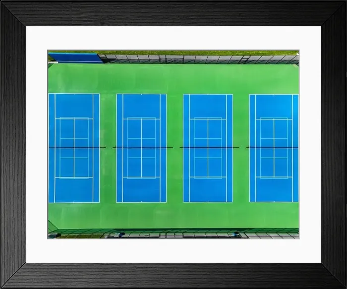 Framed Print : Aerial, drone, photo of new outdoor blue tennis court with white lines combined with light blue pickleball lines Framed Print : Aerial, drone, photo of new outdoor blue tennis court with white lines combined with light blue pickleball lines