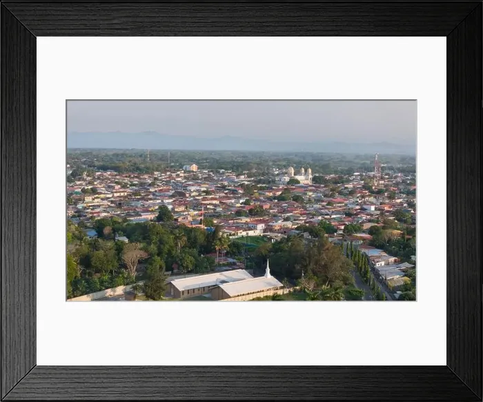 Framed Print : Diriamba, Nicaragua - May 26, 2024: Churches roof in Diriamba city aerial drone view on sunset time