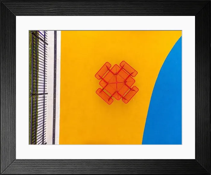 Framed Print : Aerial, drone, photo, of a red vinyl coated picnic tables on a multi color playground surface Framed Print : Aerial, drone, photo, of a red vinyl coated picnic tables on a multi color playground surface