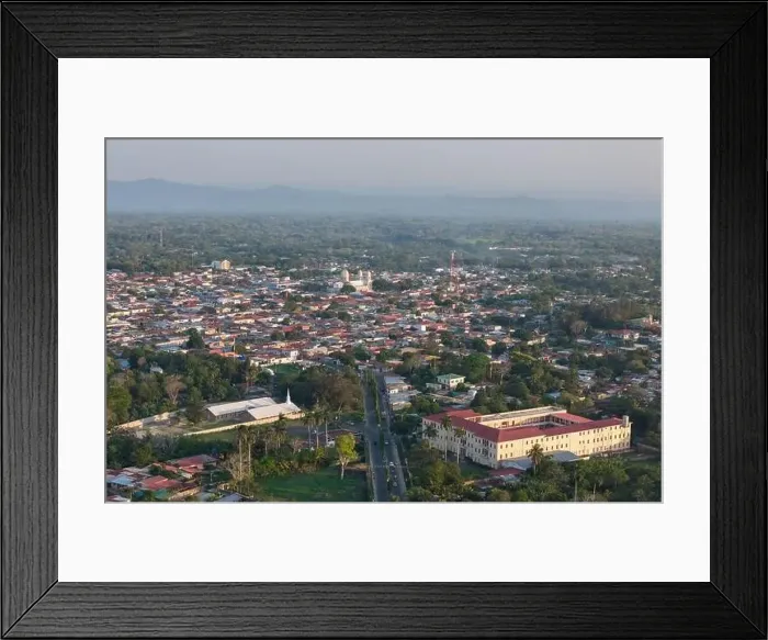 Framed Print : Diriamba, Nicaragua - May 26, 2024: Diriamba cityscape on sunset time aerial view witn main road Framed Print : Diriamba, Nicaragua - May 26, 2024: Diriamba cityscape on sunset time aerial view witn main road