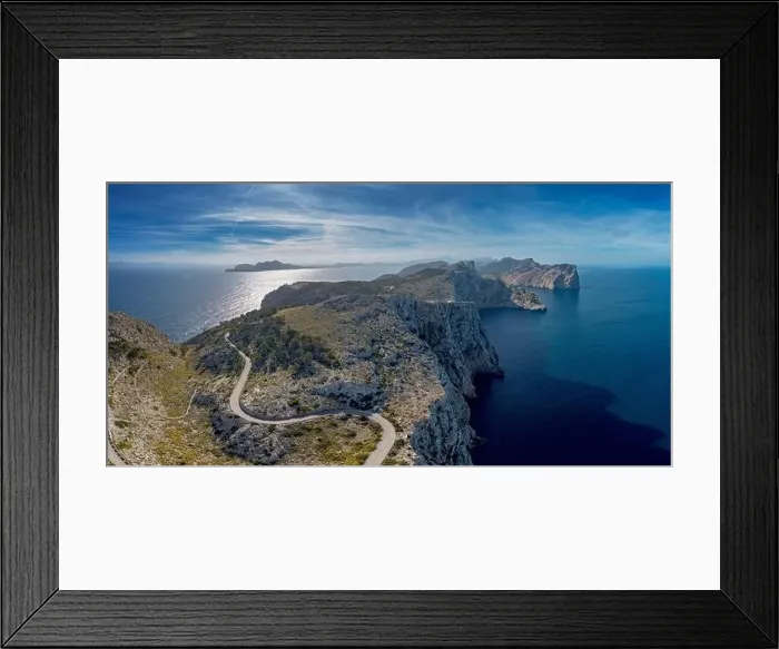 Framed Print : Aerial panorama landscape view of the curving road and rugged Cap de Formentor in northwestern Mallorca Framed Print : Aerial panorama landscape view of the curving road and rugged Cap de Formentor in northwestern Mallorca