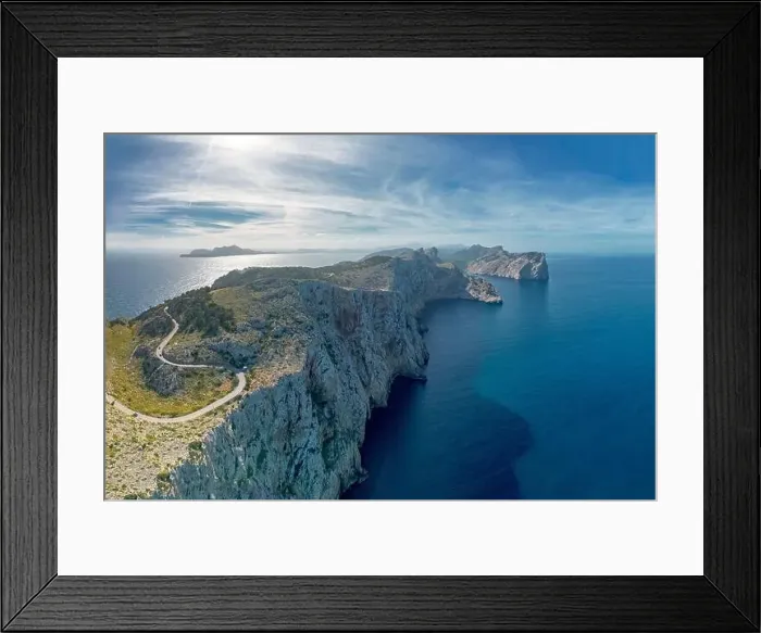 Framed Print : Aerial panorama landscape view of the curving road and rugged Cap de Formentor in northwestern Mallorca Framed Print : Aerial panorama landscape view of the curving road and rugged Cap de Formentor in northwestern Mallorca